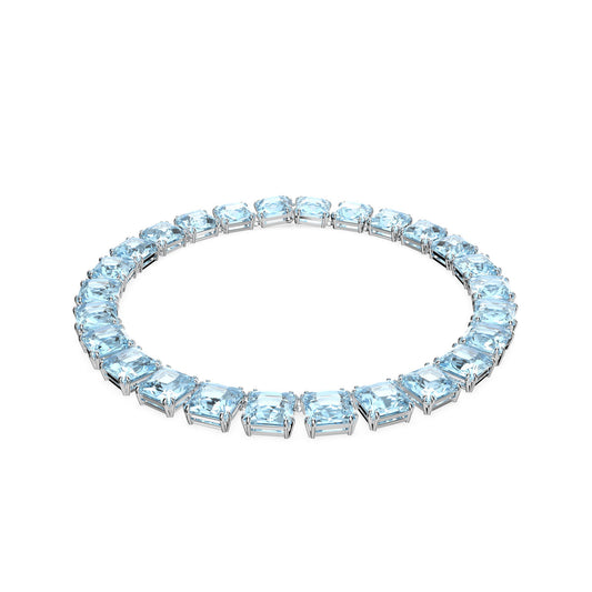 Explore the sophistication of Swarovski with the Cushion Cut Crystal Harmonia Choker. This exquisite piece features a continuous circle of light blue crystals, each square-cut aquamarine gemstone set in a sleek metallic band, all beautifully accentuated against a plain white background.