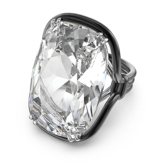 The Swarovski Oversized Crystal Harmonia Cocktail Ring by Swarovski features a cushion-cut crystal in an oversized design, set in a sophisticated silver ring with four prongs. Its smooth and polished band adds to the ring's elegant and luxurious appeal.