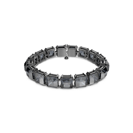 The Swarovski Medium Square Cut Crystal Millenia Bracelet, crafted with luxury rhodium plating, showcases a sequence of large square-cut crystals in a graphite hue set within a continuous metallic band, elegantly displayed on a plain white background.