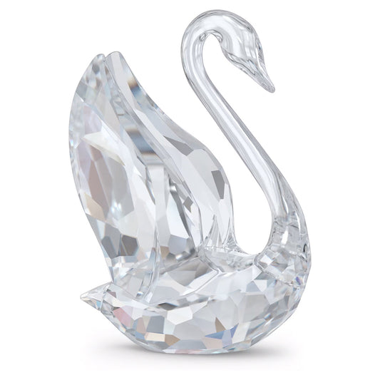 The Swarovski Signum Swan Home Décor, a creation under the Swarovski brand, features exquisitely crafted outspread wings and intricate facets that reflect light to produce a mesmerizing sparkle. This elegant piece showcases graceful curves and a sleek neck, all crafted from clear crystal for timeless beauty.