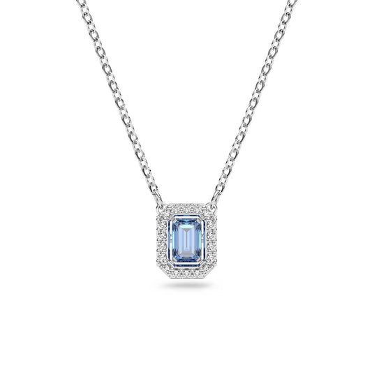 The Swarovski Millenia Octagon Cut Necklace features a captivating blue octagon-cut gemstone pendant, encased in a decorative frame of clear stones. The delicate chain, designed with simple links, elegantly highlights the stunning blue centerpiece.
