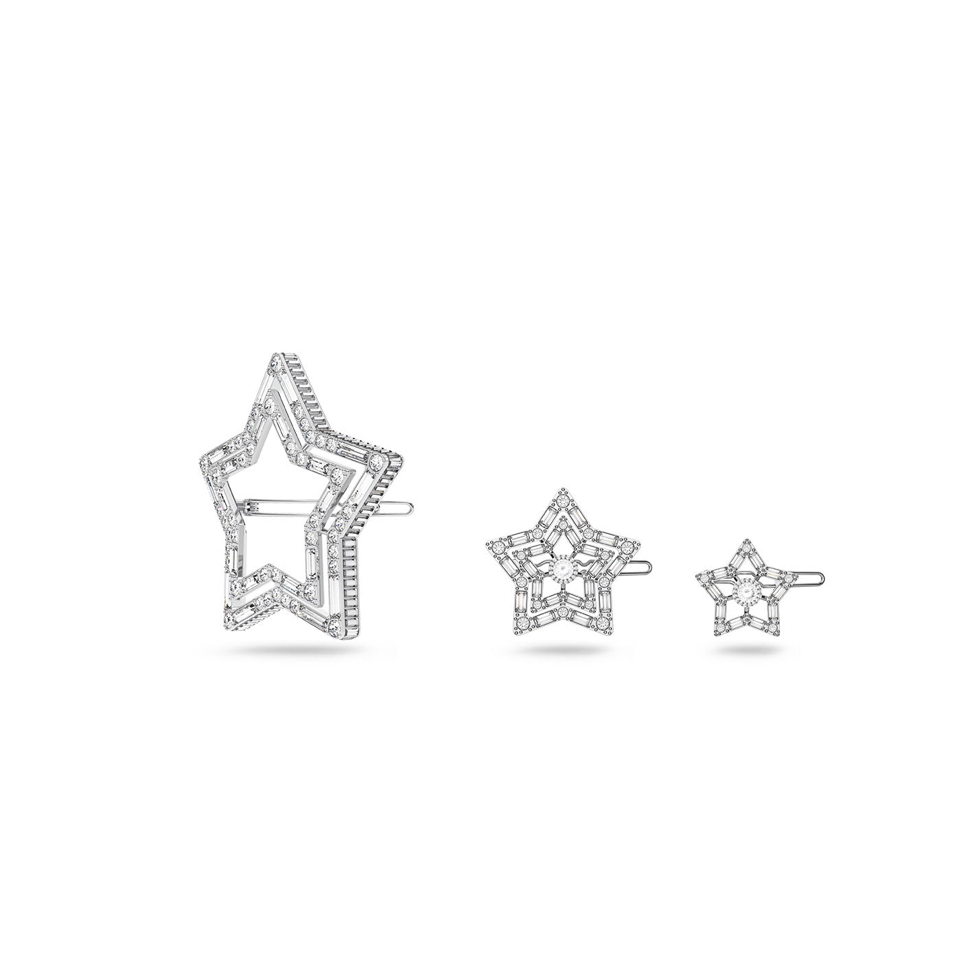 The Swarovski Star Hair Clip Set by Swarovski comprises three star-shaped hairpins set against a white background. The largest pin features two stacked star outlines embellished with clear crystals, while the two smaller pins boast intricate, crystal-studded designs. Each piece is rhodium plated for an elegant finish.