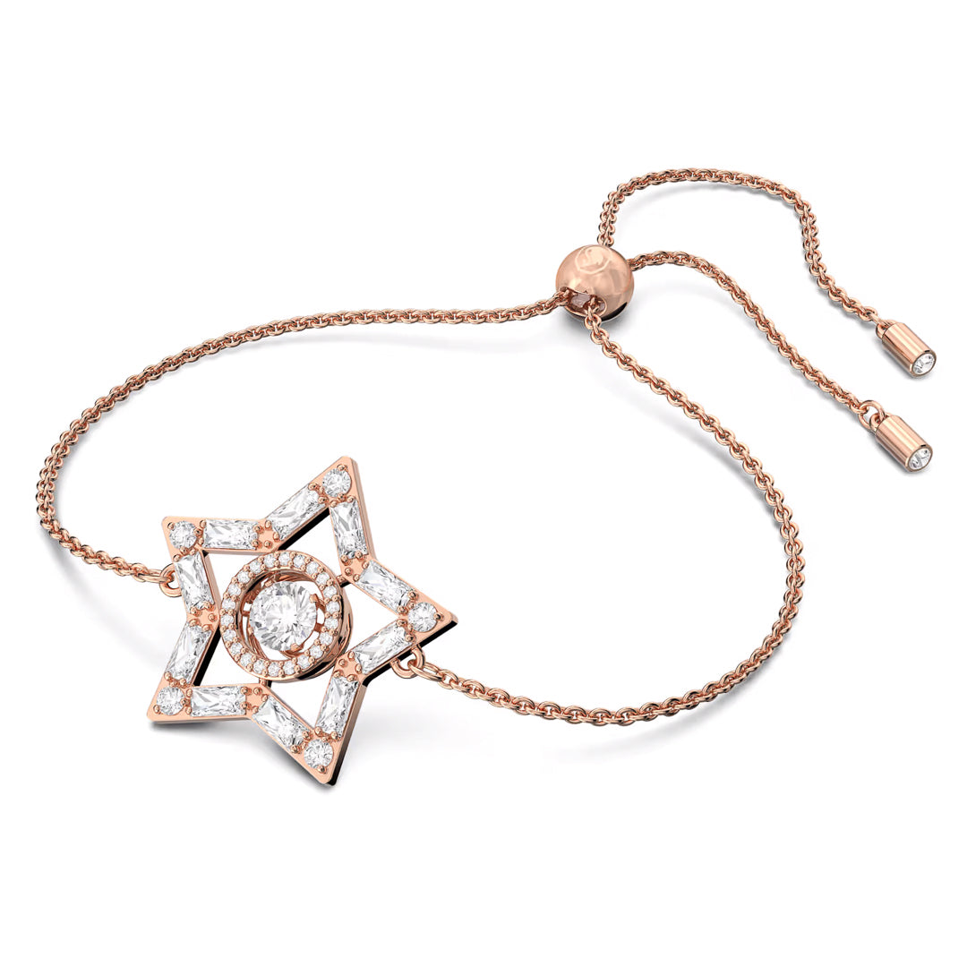 As a piece from the Swarovski Stella collection, the Swarovski Stella Bracelet showcases a rose gold-tone star-shaped pendant with a central round diamond encircled by smaller diamonds. It includes an adjustable chain featuring two ends accented with diamonds, delivering an elegant and sophisticated design synonymous with the Swarovski brand.