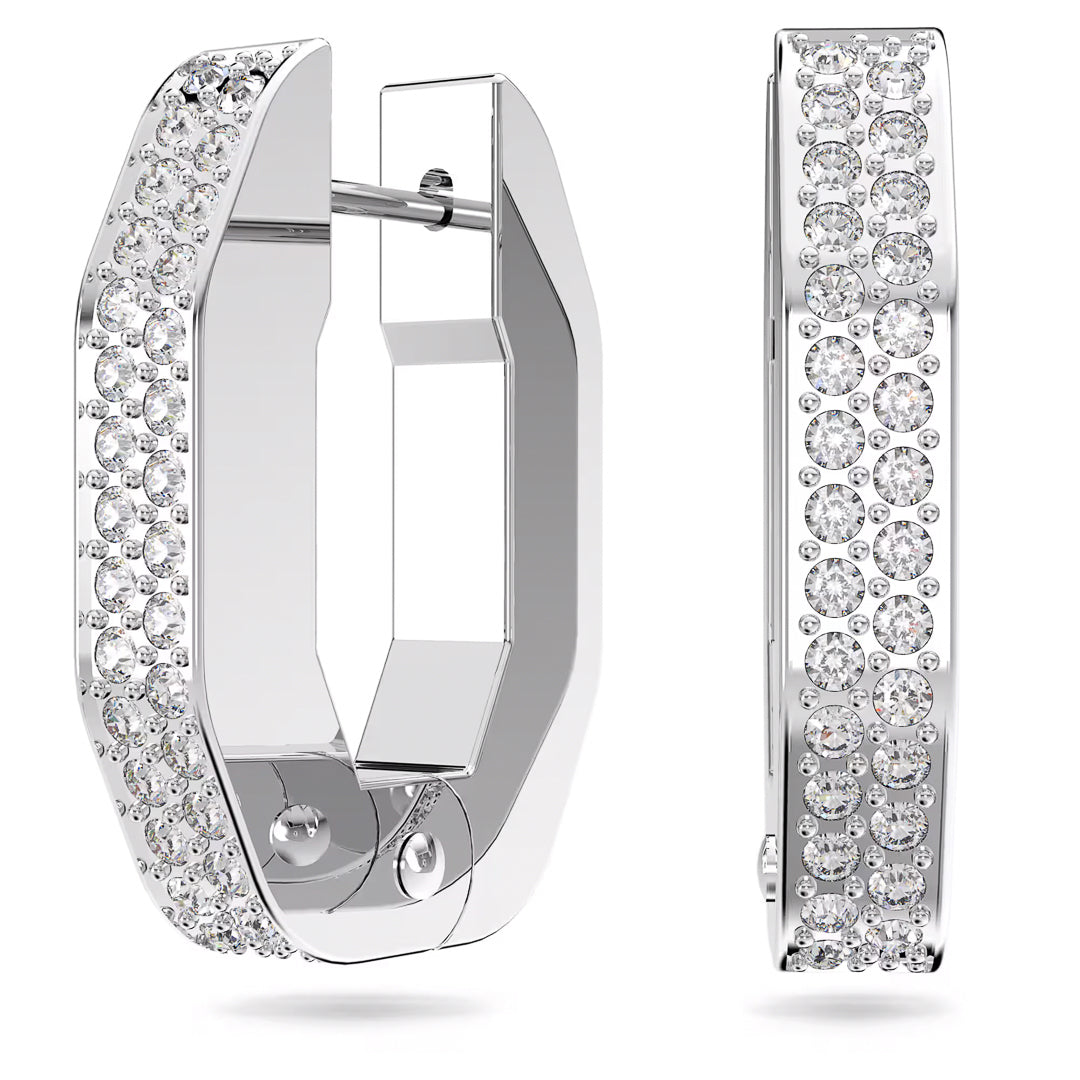 These Swarovski Dextera Hoop Earrings showcase a stunning hexagonal design, featuring the pavé technique with small round crystals encrusted on their outer surfaces for a sparkling and elegant appearance.