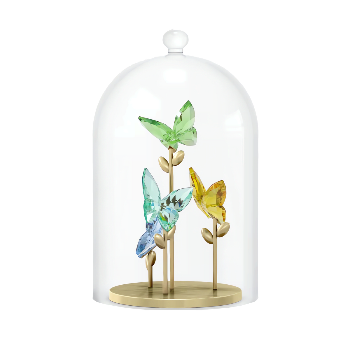 The Swarovski Jungle Beats Butterfly Bell Jar by Swarovski features three vibrant crystal butterfly figurines perched on gold stems, elegantly presented inside a clear glass dome with a gold-toned base, all set against a plain white background.