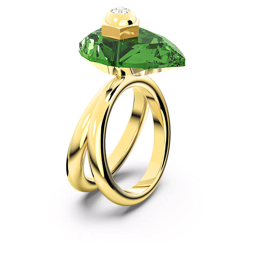 The Swarovski Numina Ring, created by the renowned brand Swarovski, showcases a large angular green crystal set atop double gold bands and accentuated by a small round diamond, making its modern design truly eye-catching.