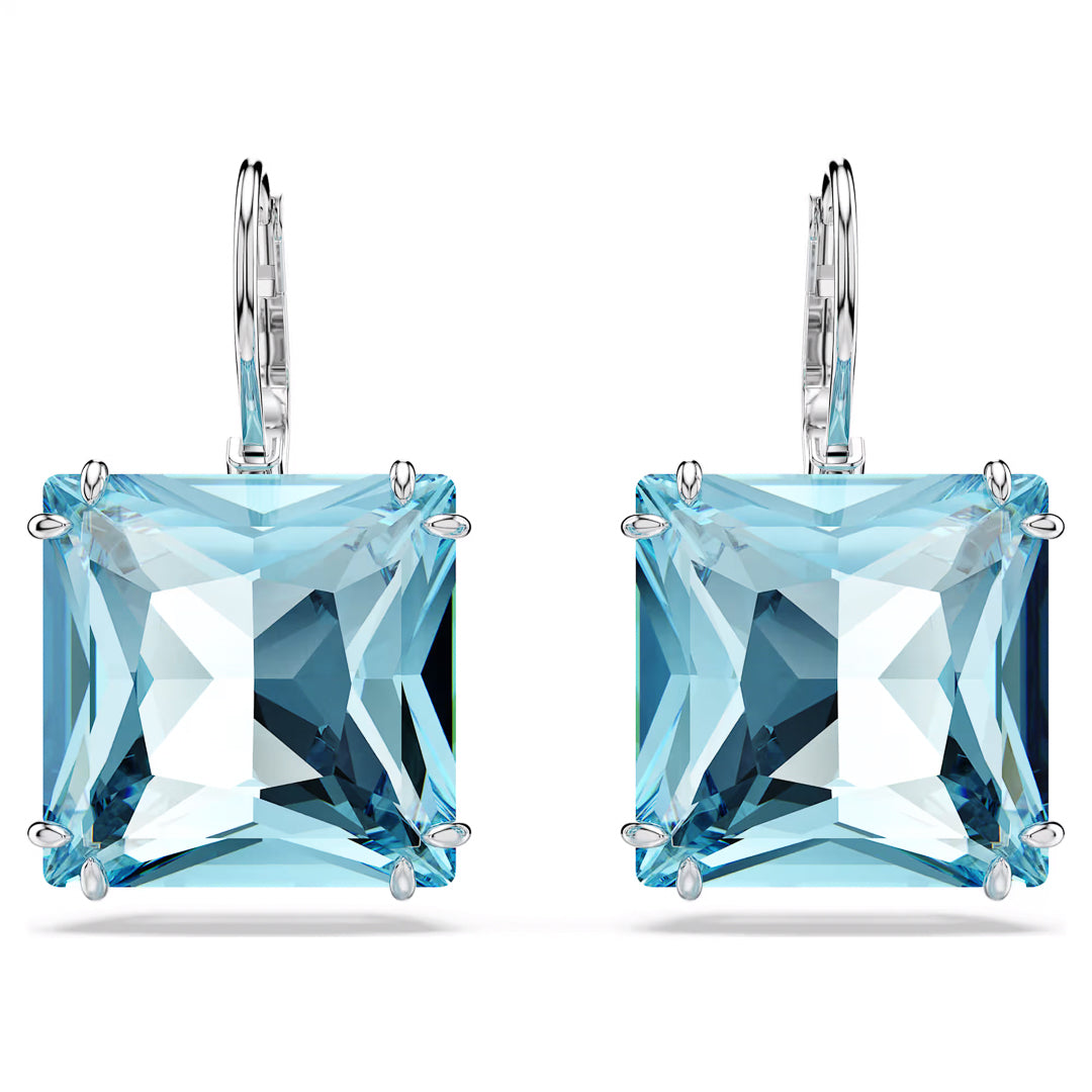 Introducing the Swarovski Millenia Drop Earrings by Swarovski, a stunning pair of earrings featuring square-cut aquamarine crystals set in silver prongs. These exquisite pierced earrings boast a faceted design with lever-back clasps, showcasing a light blue hue and sparkling highlights against a white backdrop.