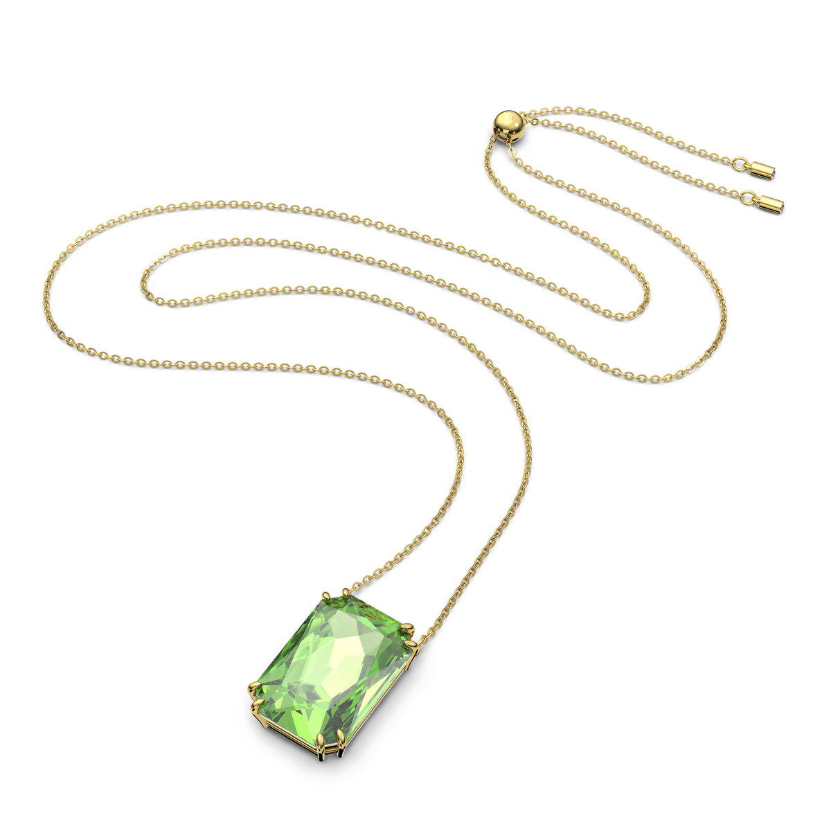 A Swarovski Millenia pendant, featuring a striking octagon cut green gemstone set in gold-tone plating, is elegantly displayed on a white background. This exquisite necklace from Swarovski is available in Canada.