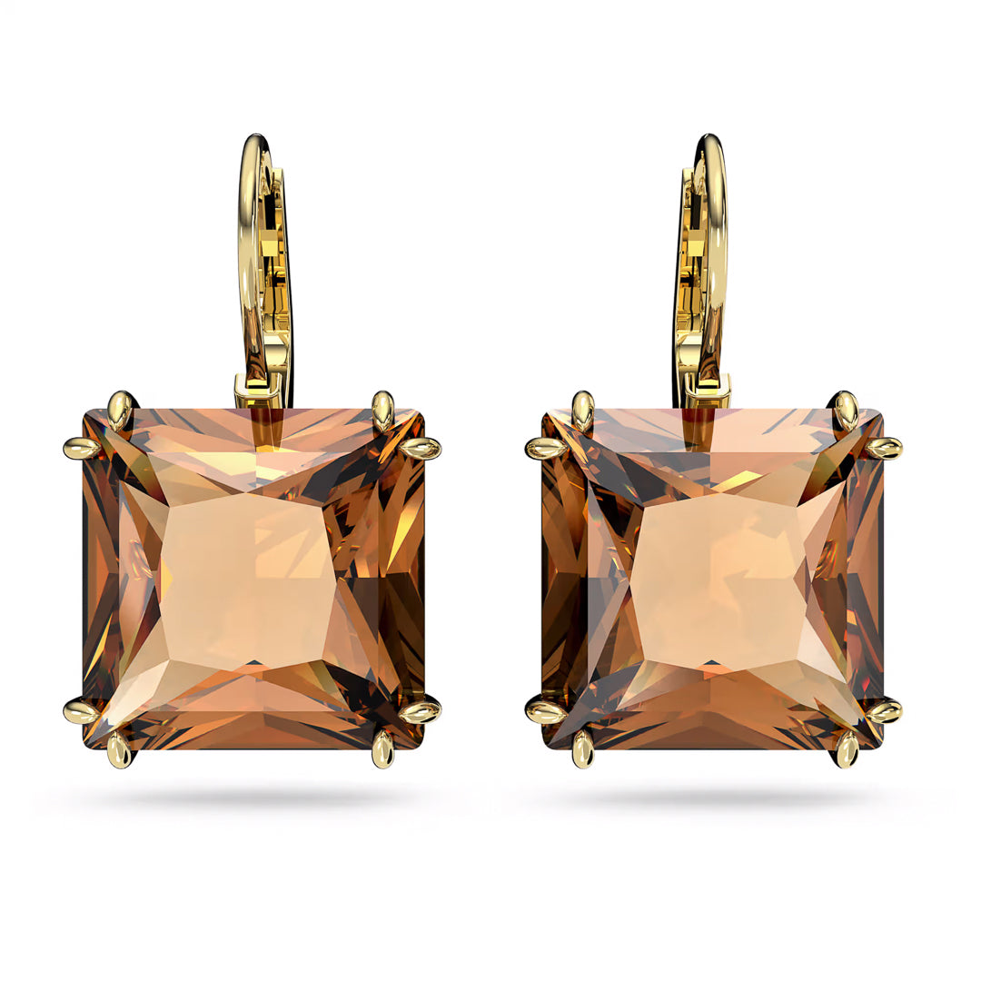 The Swarovski Millenia Drop Earrings, crafted by Swarovski, feature a gold-tone plating with large, square-cut crystals in a prong setting. They have an elegant and shiny appearance that beautifully reflects light.