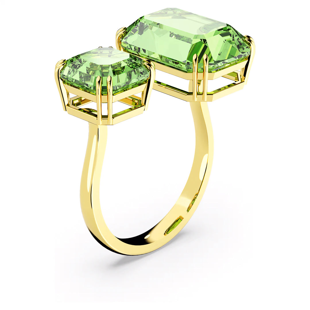 The Swarovski Millenia Open Ring features an elegant design with two adjacent green octagon-cut crystals. The larger crystal is set vertically, complemented by a smaller horizontal one, both held in four-prong settings, creating a sophisticated modern look.
