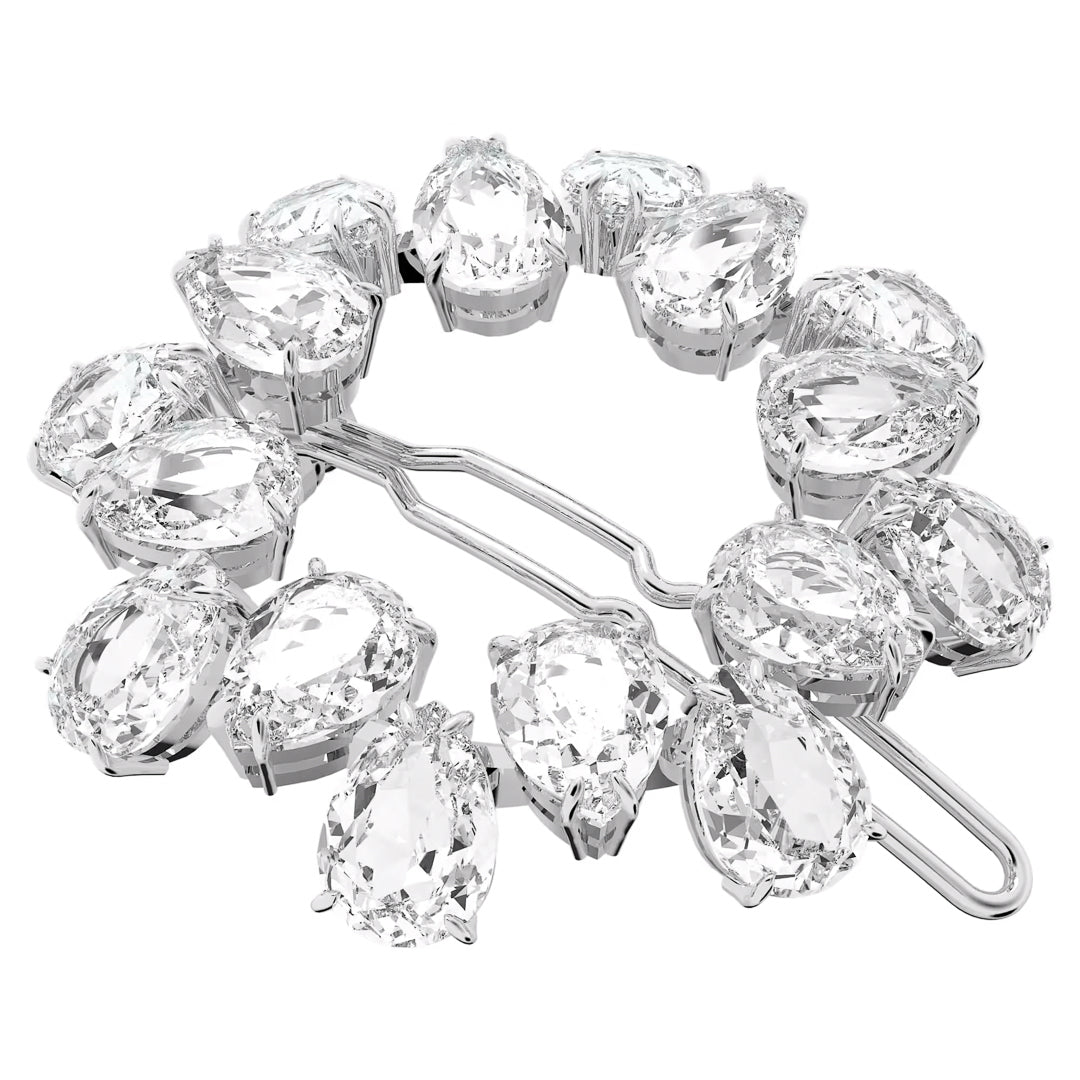 The Swarovski Millenia Hair Clip is a silver accessory adorned with large, clear pear-cut crystals arranged in a circular design, each stone securely set in metal prongs.