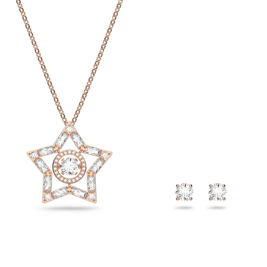 The Swarovski Mixed Cuts Stella Necklace and Earrings Set, crafted by the renowned brand Swarovski, features a star-shaped pendant embellished with small diamonds on a delicate chain to the left. On the right rests a pair of classic diamond stud earrings. This elegant ensemble is highlighted against a simple white background and is beautifully enhanced by exquisite rose gold-tone plating.
