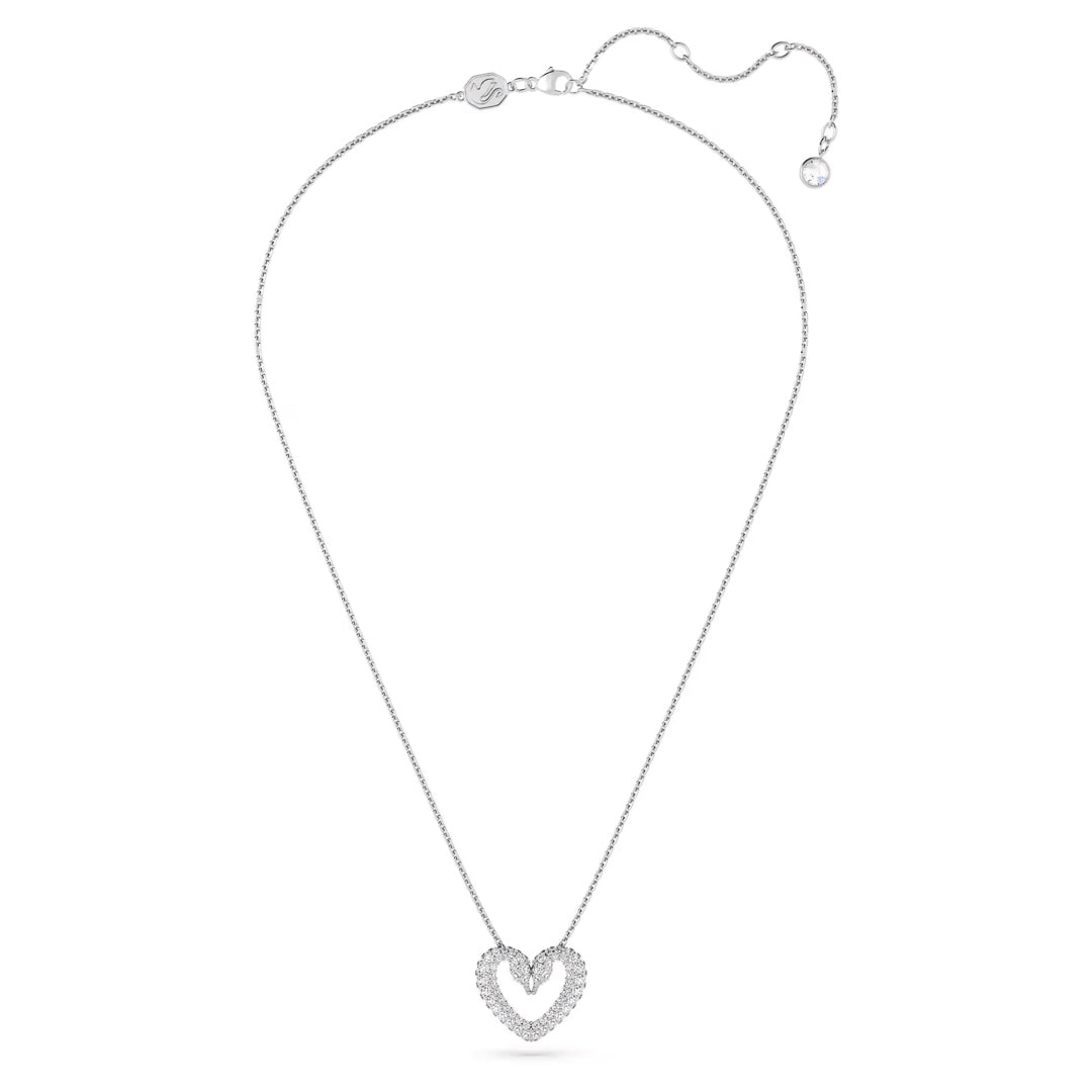 Introducing the Swarovski Sublima Heart Necklace Pendant by Swarovski: a breathtaking necklace that features a heart-shaped pendant adorned with pavé crystals. The delicate chain includes an adjustable clasp, and the pendant boasts a refined double outline design, adding an extra touch of elegance.
