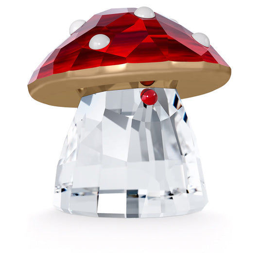 The Swarovski Holiday Cheers Red Mushroom Home Décor by Swarovski brings festive charm with its transparent crystal base and red cap adorned with white spots. The glossy finish of the cap, along with a small red detail near the base, highlights the allure of this delightful holiday ornament.