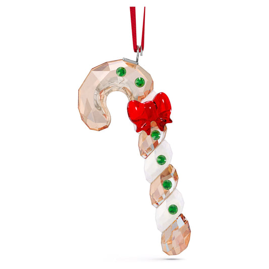 The Swarovski Holiday Cheers Gingerbread Candy Cane Ornament Home Décor features a delightful design with alternating clear and frosted segments, embellished with small green gems and a red bow, all hanging from a red ribbon. This exquisite decoration by Swarovski brings charm to any plain white background, its crystal accents catching the light beautifully.
