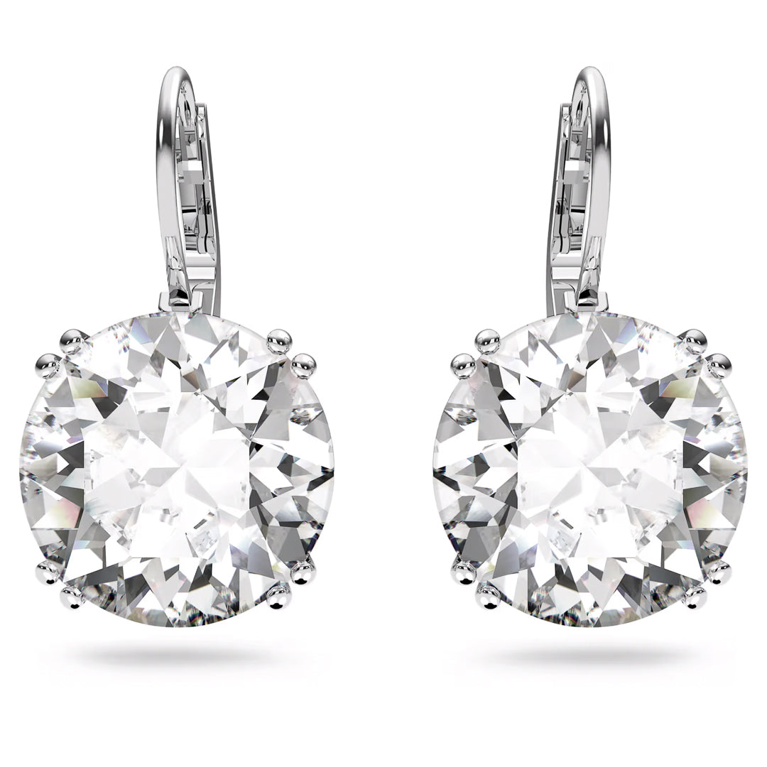 The Swarovski Millenia Drop Earrings are an elegant pair of silver earrings that feature large, round-cut crystals in a rhodium-plated claw setting. The lever-back closure provides a secure fit, while the stones capture light beautifully, showcasing their unparalleled brilliance.