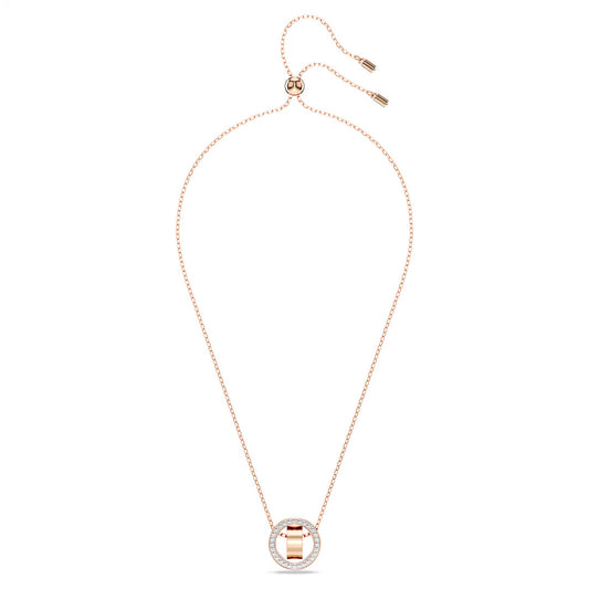 The Swarovski Dextera Necklace Pendant by Swarovski features a delicate gold chain with an adjustable clasp. It showcases a circular pendant that has a rose gold-tone finish and is partly encrusted with crystal pavé, offering simple elegance against a white background.