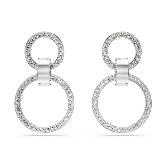Introducing the Swarovski Hollow Hoop Earrings by Swarovski, designed with two interlocking silver circles. The smaller circle elegantly rests above the larger one, both embellished with dazzling crystal pavé for a luxurious and sophisticated look. Rhodium plating adds an extra touch of shine, making them perfect for any occasion.
