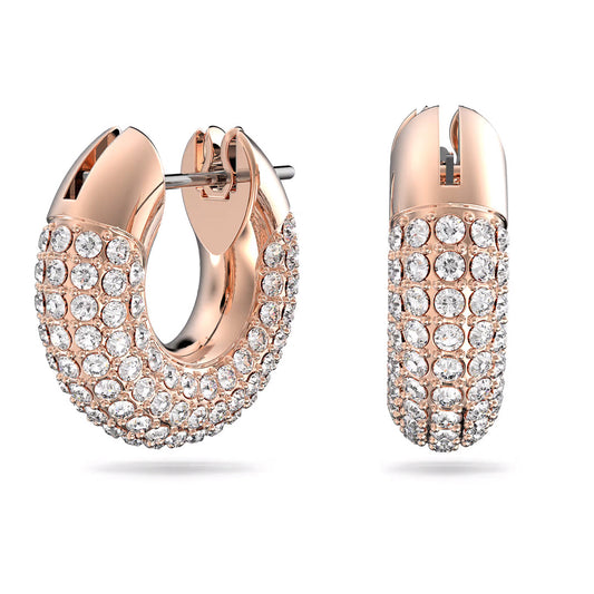 The Swarovski Dextera Hoop Earrings by Swarovski are an elegant pair of rose gold-tone hoops adorned with multiple rows of sparkling Pavé crystals, showcased against a plain white background.