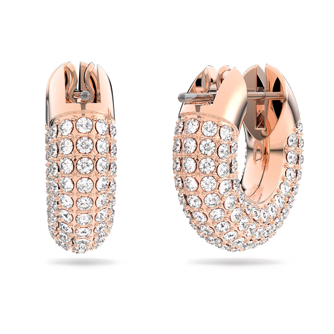 The Swarovski Dextera Hoop Earrings, featuring a rose gold-tone design and multiple rows of sparkling white gemstones reminiscent of Swarovski's Pavé craftsmanship, are elegantly displayed against a plain white background.