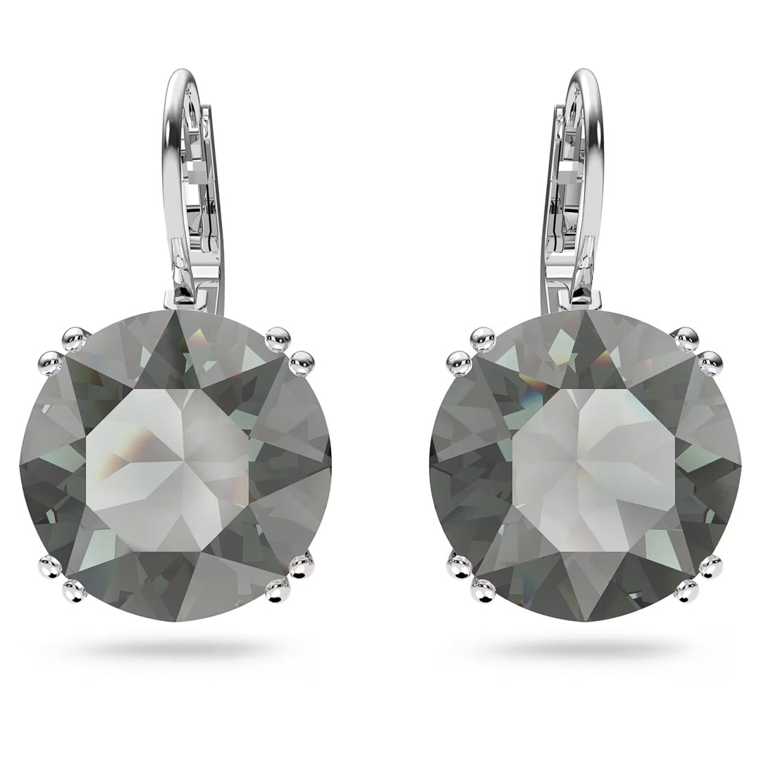 Swarovski Millenia Drop Earrings by Swarovski boast a silver-tone leverback design, showcasing large, round-cut grey gemstones in a prong setting. The rhodium-plated finish enhances the subtle shine as the crystals catch the light.