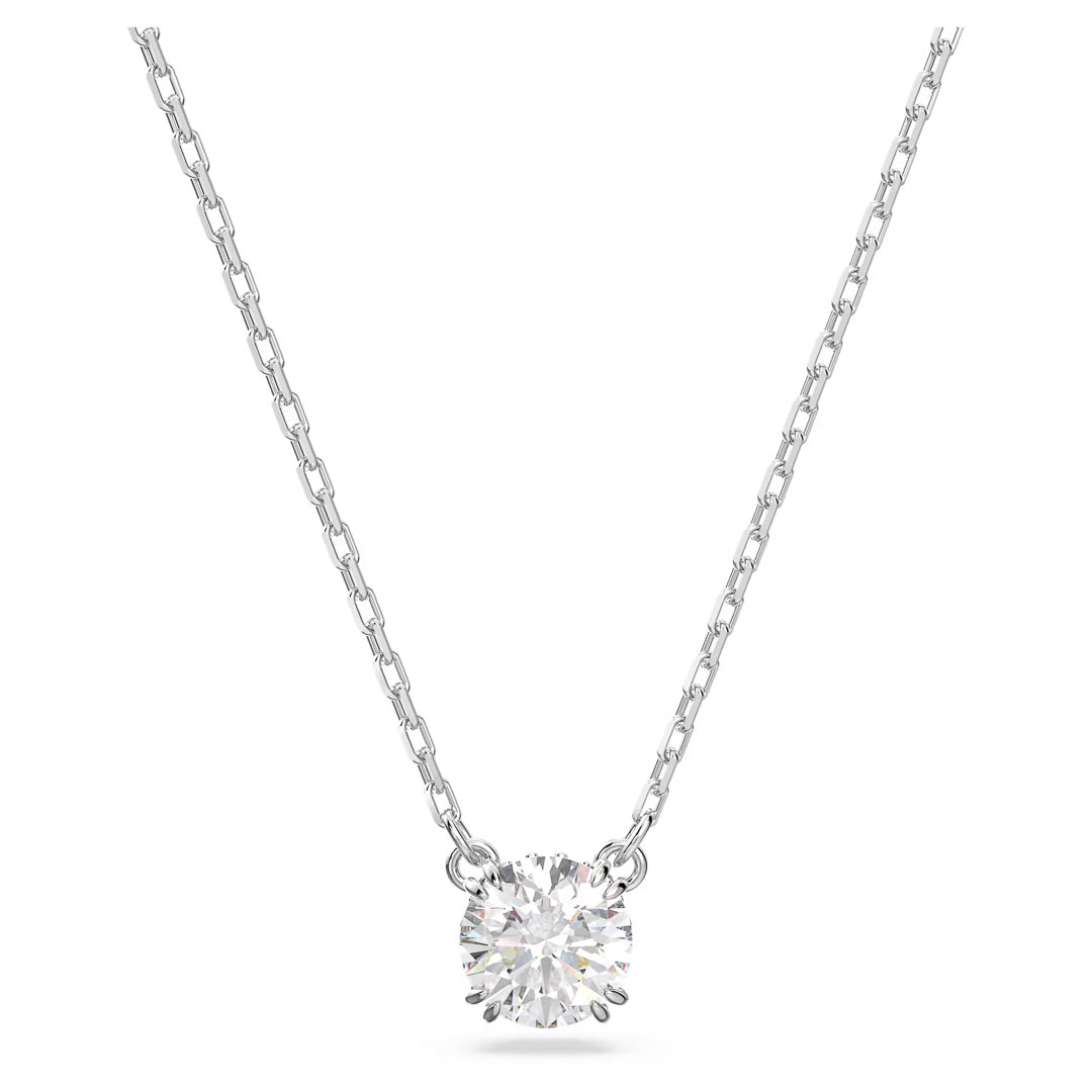 The Swarovski Stilla Necklace Pendant by Swarovski showcases a thin silver chain adorned with a central single round-cut diamond, enhanced by a rhodium-plated finish that accentuates its simple and elegant design while highlighting the diamond's brilliance.