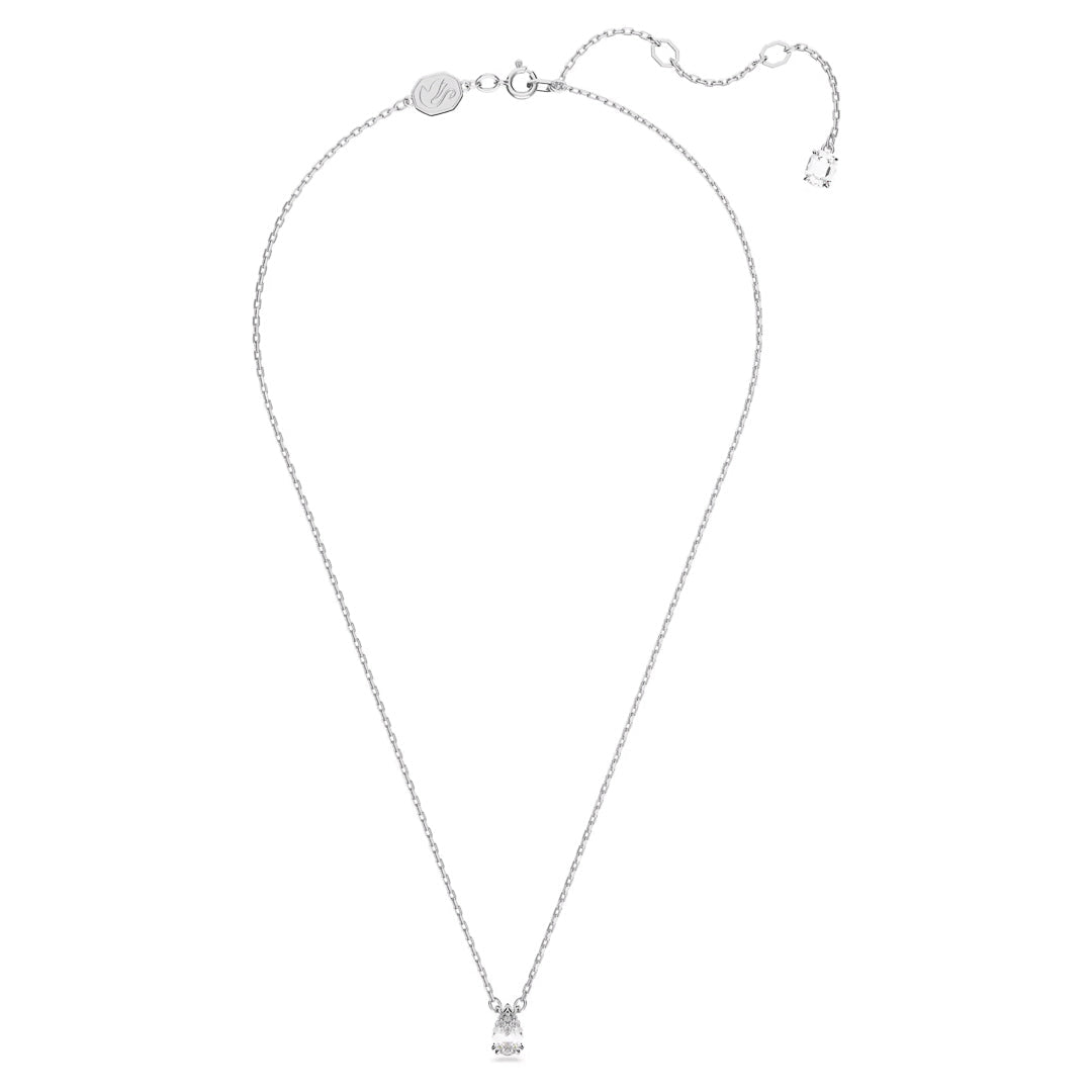 The Swarovski Stilla Necklace Pendant is a refined piece crafted from silver, featuring a delicate chain with a rhodium-plated pendant. Its triangular shape includes a subtle pear-cut stone, complemented by an adjustable clasp for versatile elegance on any occasion.