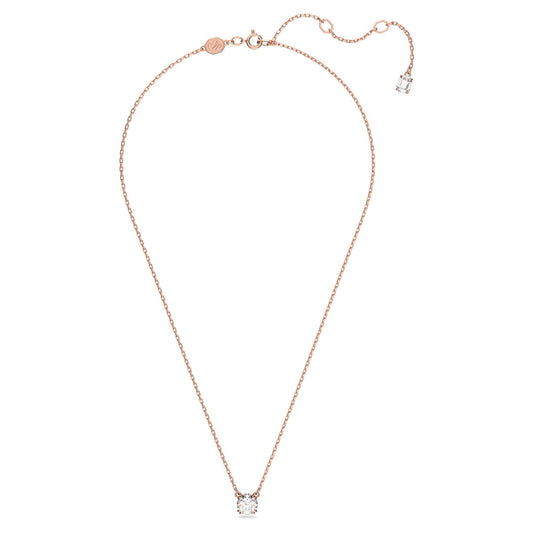 The Swarovski Stilla Necklace Pendant by Swarovski features a delicate rose gold-tone plated chain with a stunning round-cut diamond pendant. The necklace is designed with an adjustable clasp and includes an additional smaller octagon-cut stone charm at the end of the extension.