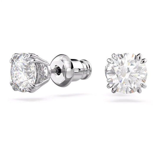 The Swarovski Stilla Stud Earrings feature large, round zirconia gemstones in a prong setting, complemented by a shiny rhodium-plated post and butterfly backings. These elegant silver stud earrings are beautifully displayed against a plain white background.