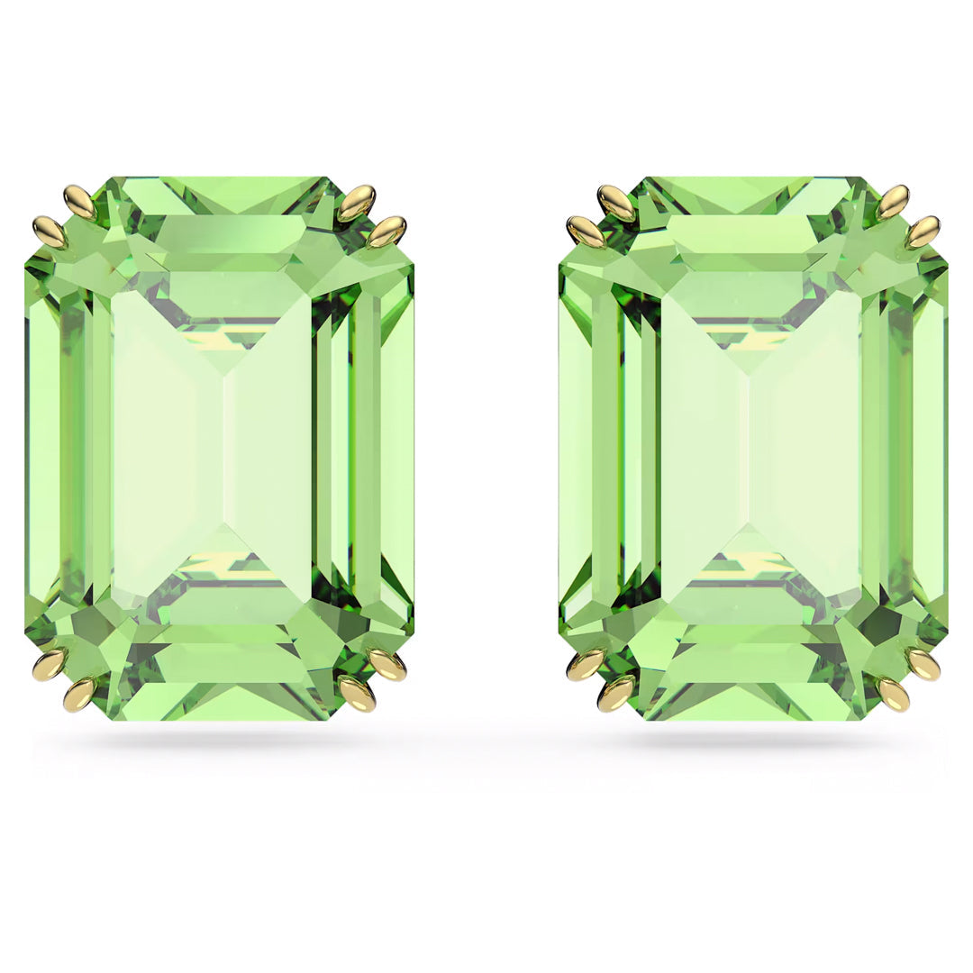 Two emerald-cut, light green gemstones are securely nestled in a six-pronged, gold-tone plated setting. Each gem showcases symmetrical facets with a clear sparkling appearance against a white backdrop, reminiscent of the exquisite Swarovski Millenia Stud Earrings crafted by Swarovski with shimmering green crystals.