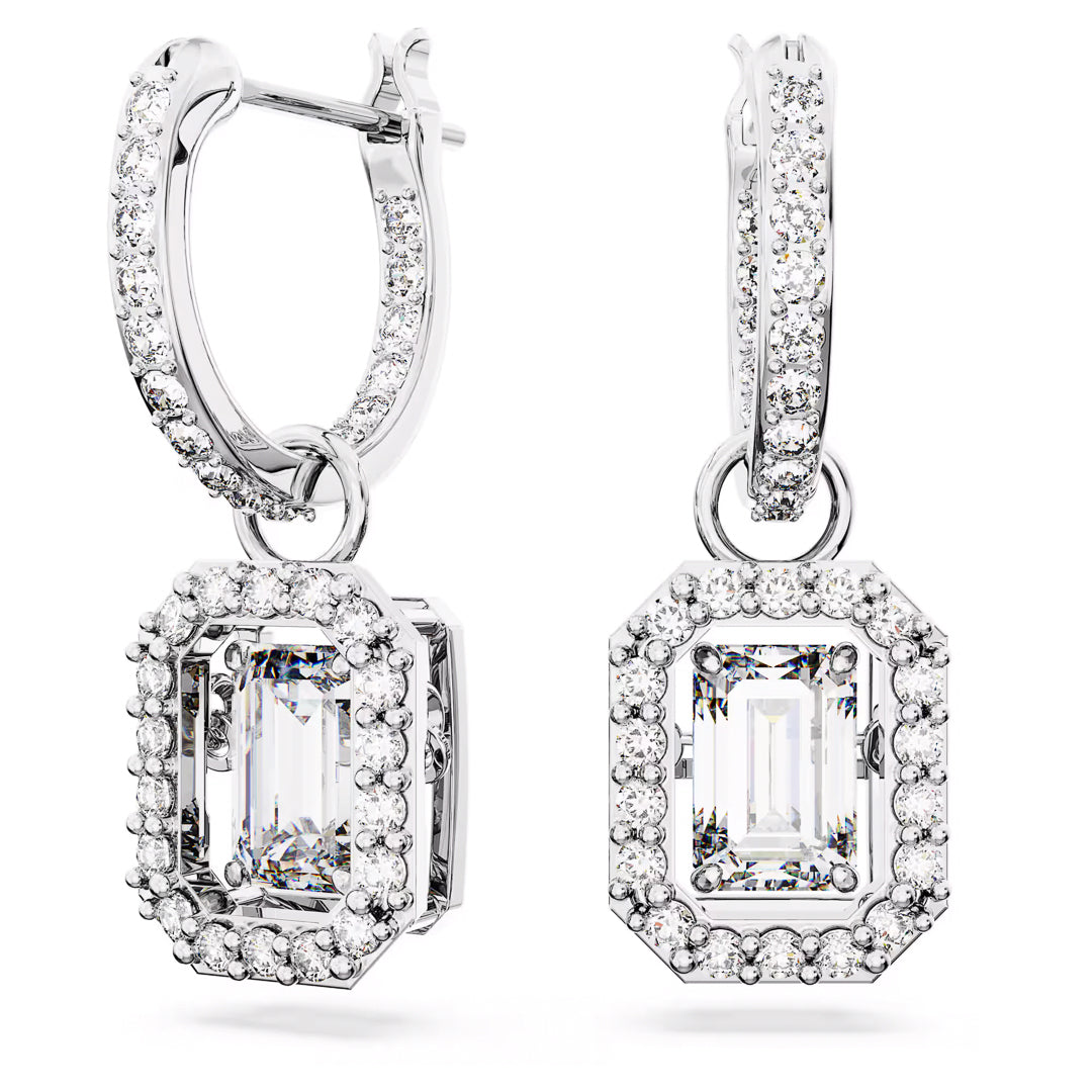 The Swarovski Una Drop Earrings by Swarovski showcase large octagon-cut gemstones encircled by smaller sparkling stones, all set in rhodium-plated silver-tone metal, offering an elegant drop hoop design.