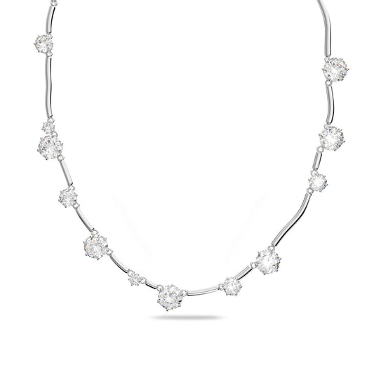 Introducing the exquisite Swarovski Mixed Round Cuts Crystal Constella Necklace, a delicate silver piece by Swarovski that features rhodium-plated, sparkling crystal clusters resembling twinkling constellations. Each cluster is evenly spaced and gracefully arranged in a gentle curve against a plain white background.