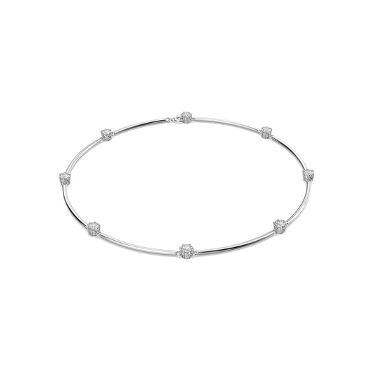 The Swarovski Round Cut Constella Necklace, designed by Swarovski, is a rhodium-plated silver piece adorned with small, round Swarovski Zirconia stones spaced evenly along its length, achieving an elegant and minimalist look.