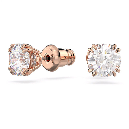 The Swarovski Stilla Stud Earrings by Swarovski are a pair of round-cut diamond stud earrings set in a rose gold-tone. They feature secure backings with diamonds showcased prominently in a classic six-prong setting, enhancing their brilliance against the warm metal. The design is further elevated by additional dazzling stones that add to their elegance.