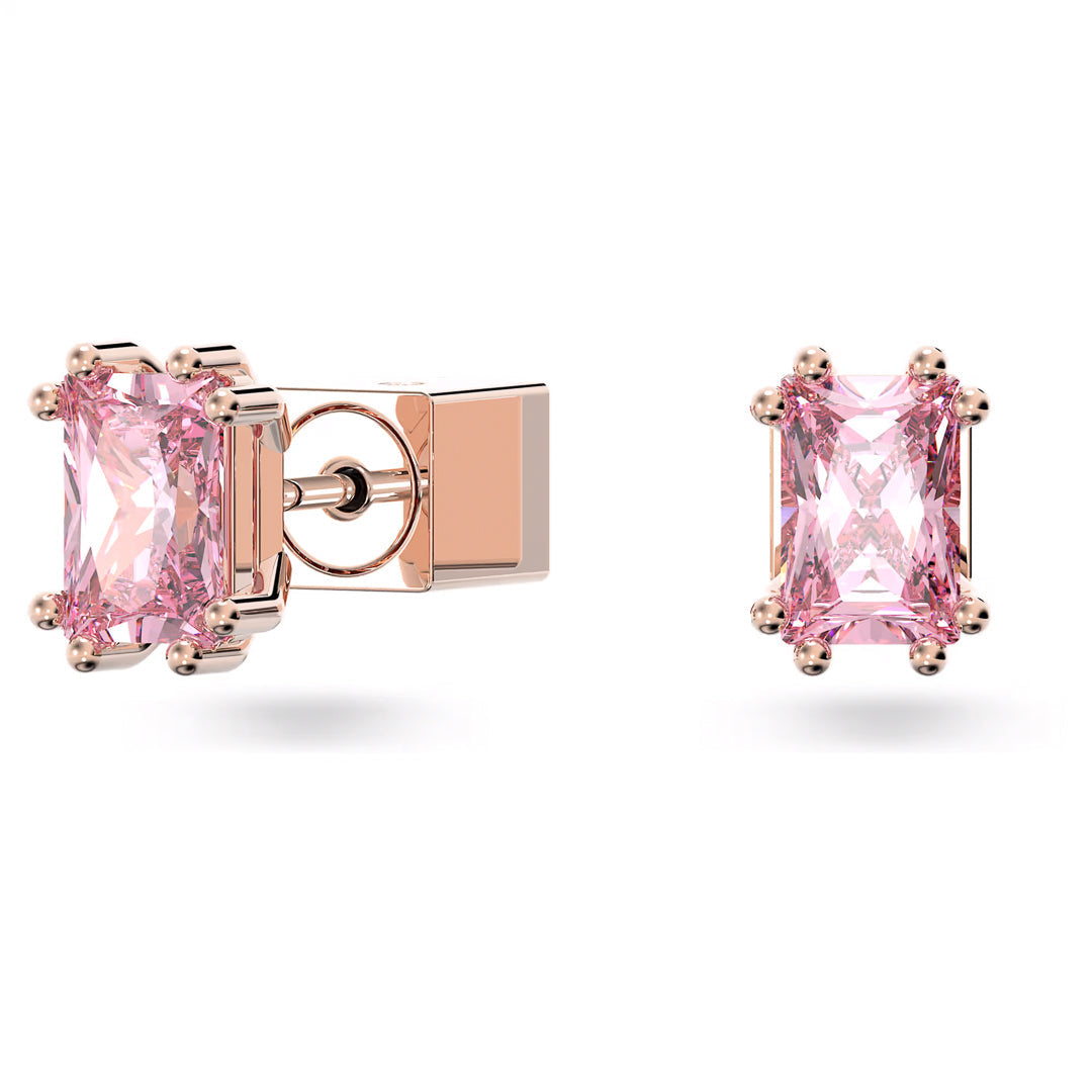 The Swarovski Chroma Stud Earrings, crafted by the renowned brand Swarovski, feature a pair of rectangular pink zirconia stones set in a rose gold-tone with a distinctive four-prong clasp on the left earring. They are elegantly presented against a simple white background.