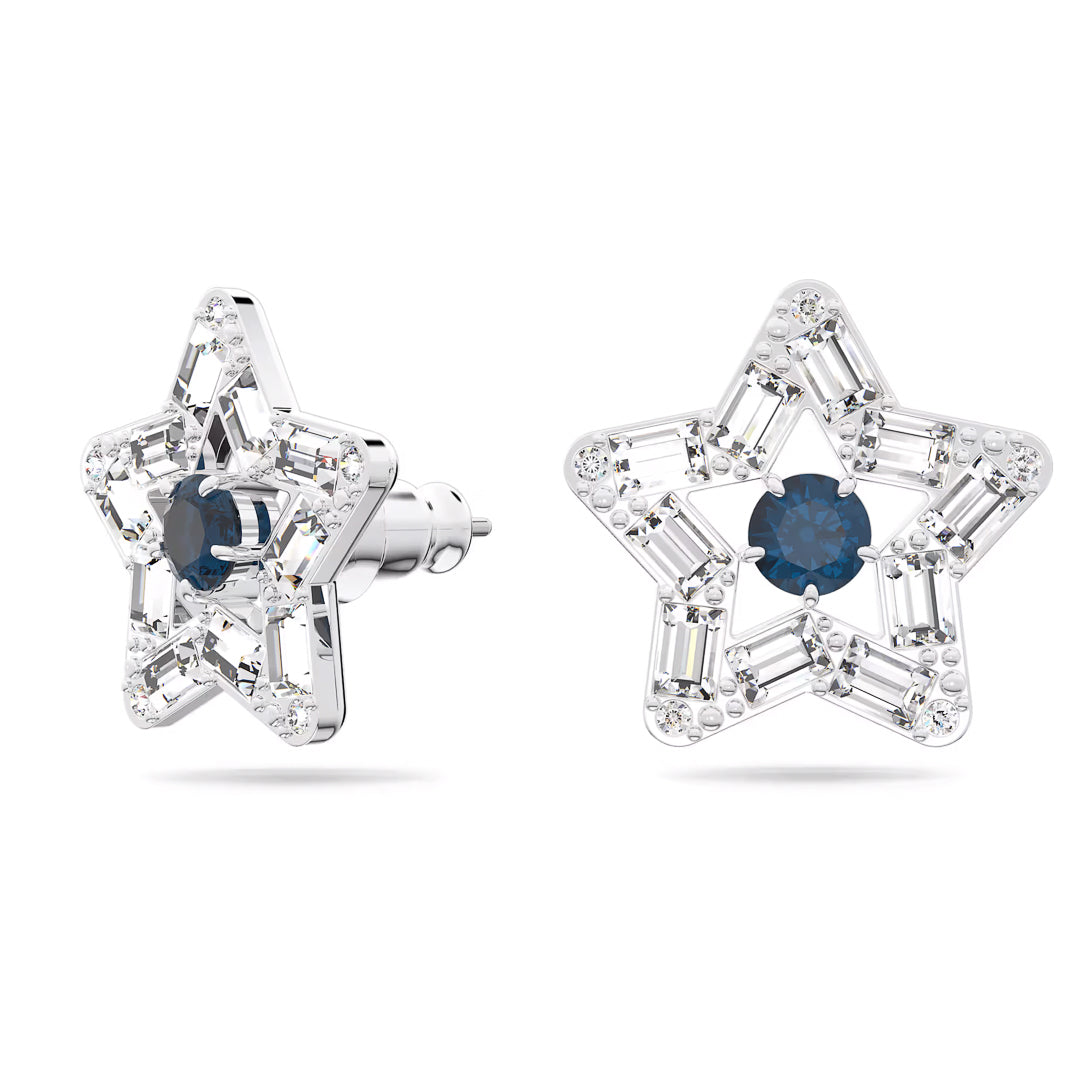 The Swarovski Stilla Stud Earrings from Swarovski feature an intricate star-shaped motif adorned with shimmering silver stars embellished with clear gemstones, each showcasing a deep blue stone at the center. Rhodium plating enhances their shine, making these earrings truly dazzling.
