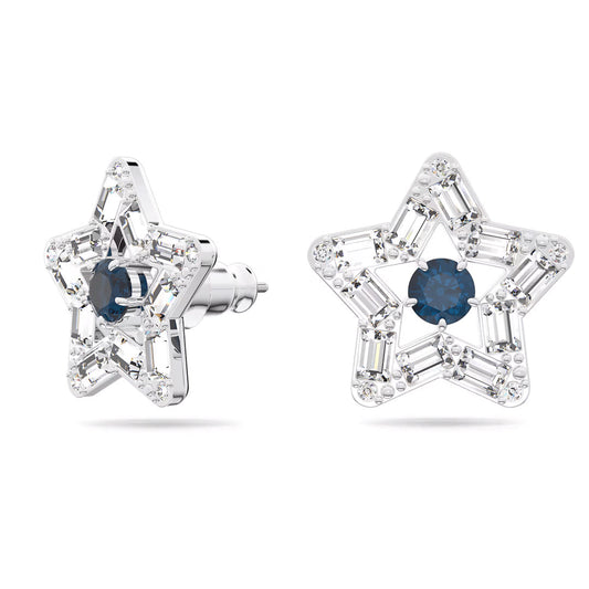 The Swarovski Stilla Stud Earrings from Swarovski feature an intricate star-shaped motif adorned with shimmering silver stars embellished with clear gemstones, each showcasing a deep blue stone at the center. Rhodium plating enhances their shine, making these earrings truly dazzling.