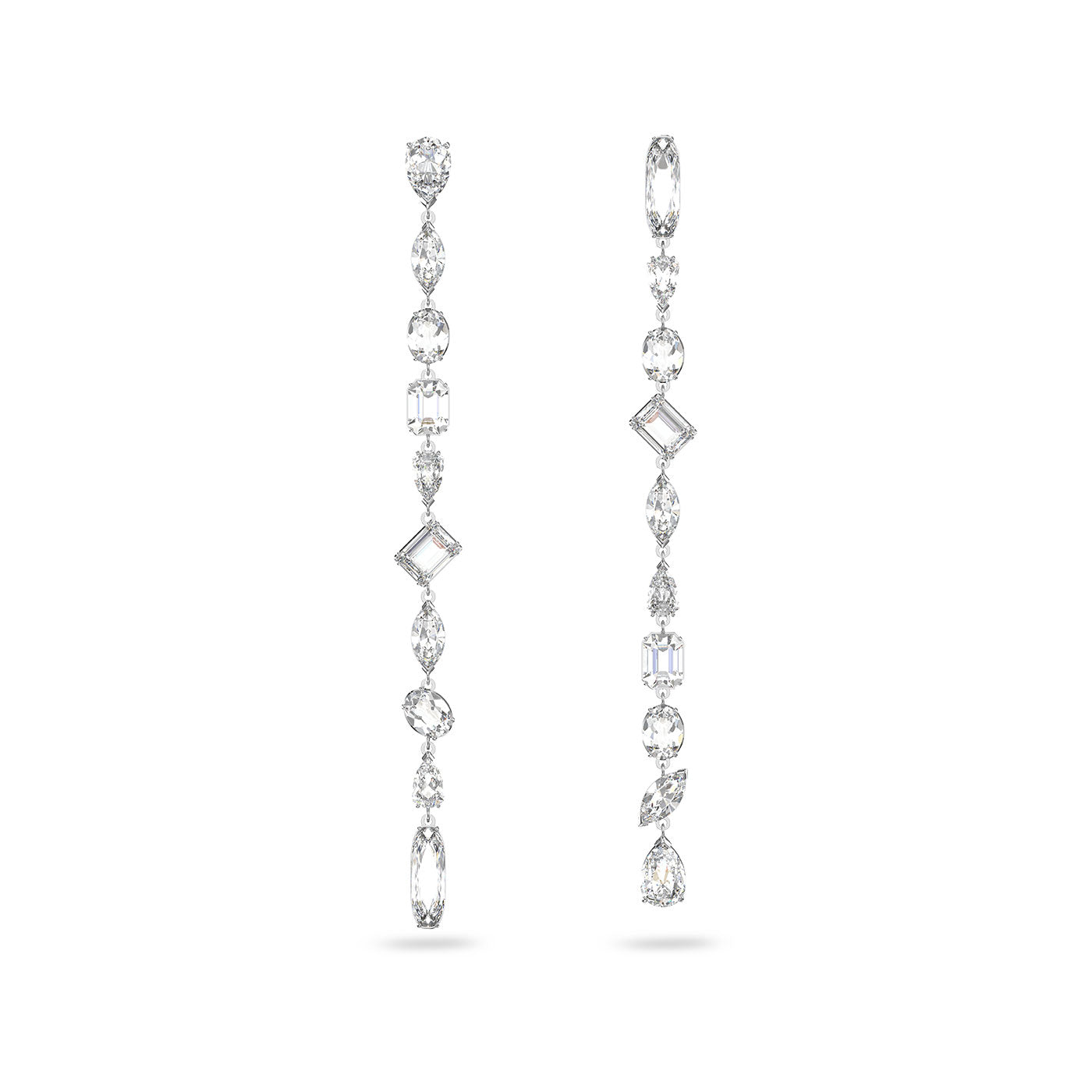 Introducing the Swarovski Mixed Cuts Gema Extra Long Drop Earrings by Swarovski, an exquisite design plated in rhodium. These earrings feature a dazzling array of gemstones and crystals shaped as ovals, rectangles, and teardrops, embodying sophistication and style with their symmetrical elegance.