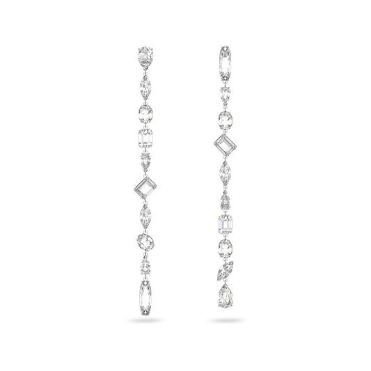 Introducing the Swarovski Mixed Cuts Gema Extra Long Drop Earrings by Swarovski, an exquisite design plated in rhodium. These earrings feature a dazzling array of gemstones and crystals shaped as ovals, rectangles, and teardrops, embodying sophistication and style with their symmetrical elegance.