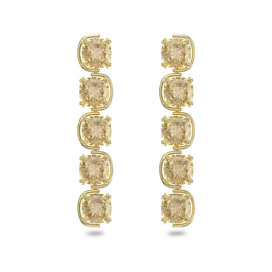 Introducing the Swarovski Cushion Cut Harmonia Drop Earrings: These stunning earrings from Swarovski feature three vertically stacked yellow cushion-cut diamonds, each set in exquisite gold-tone plated clasps that highlight their sparkle and clarity.