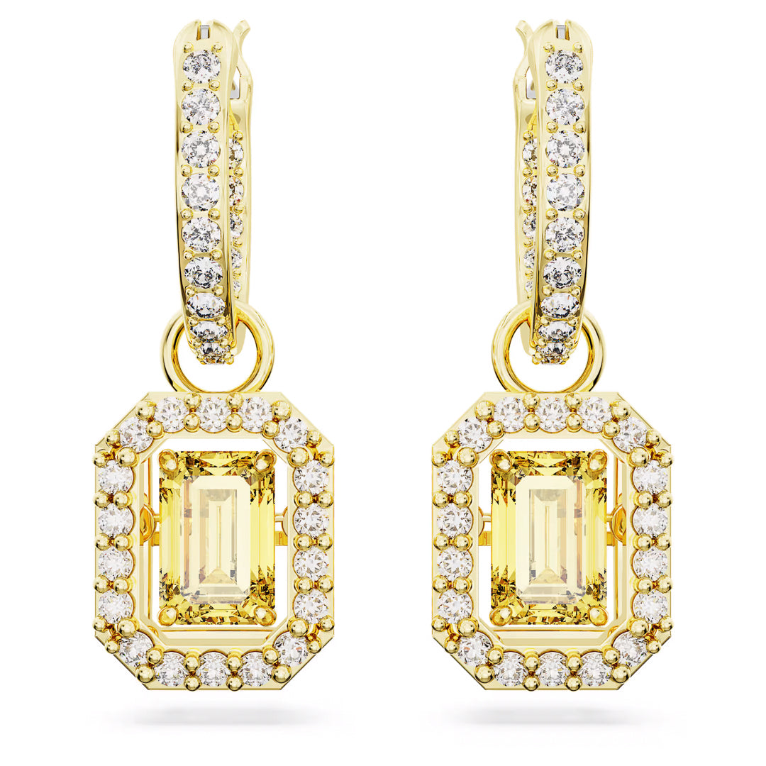 The Swarovski Una Drop Earrings by Swarovski are gold pierced earrings featuring rectangular yellow gems encircled by small clear diamonds in a stunning hoop design. Adorned with pavé crystals and intricate detailing, these earrings also include a captivating dancing stone element that adds elegance and sparkle.