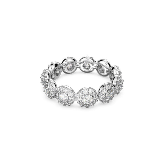 The Swarovski Round Cut Constella Ring by Swarovski is a rhodium-plated piece featuring interconnected circular settings, each adorned with small, sparkling round-cut stones. Its intricate design forms a continuous, elegant pattern around the band.