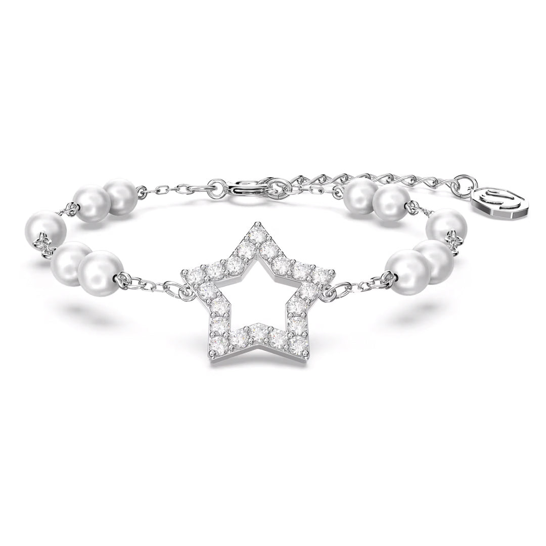 The Swarovski Stella Bracelet by Swarovski features a rhodium-plated chain adorned with a star pendant embellished with pavé-set small gemstones. The bracelet is accented with crystal pearls and includes an adjustable clasp for the perfect fit.
