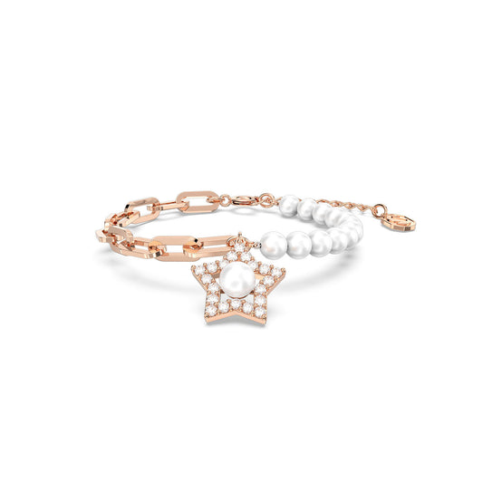 The Swarovski Stella Bracelet by Swarovski is a delicate accessory featuring two distinct sections: one adorned with crystal pearls and a rose gold-tone chain, and the other consisting of linked gold segments. It also showcases a star motif charm embellished with small pearls and crystals.
