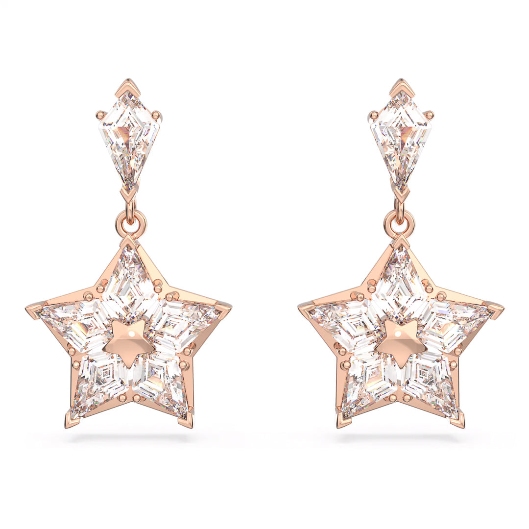 The Swarovski Stella Drop Earrings by Swarovski showcase two star-inspired designs, highlighting clear, sparkling gemstones set in rose gold-tone plating. The gems form a star within a star, attached to a smaller diamond-shaped stud.