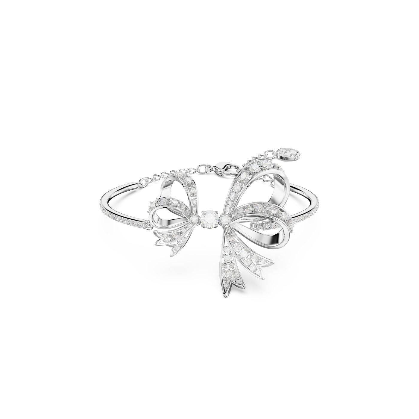 The Swarovski Volta Bow Bangle by Swarovski is a silver bangle inspired by a bow, showcasing an intricate design embellished with pavé clear crystals, set against a plain white background.