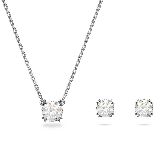 The Swarovski Round Cut Constella Necklace and Earrings Set from Swarovski showcases an elegant minimalist design with rhodium plating, featuring a round diamond pendant necklace paired with matching diamond stud earrings.