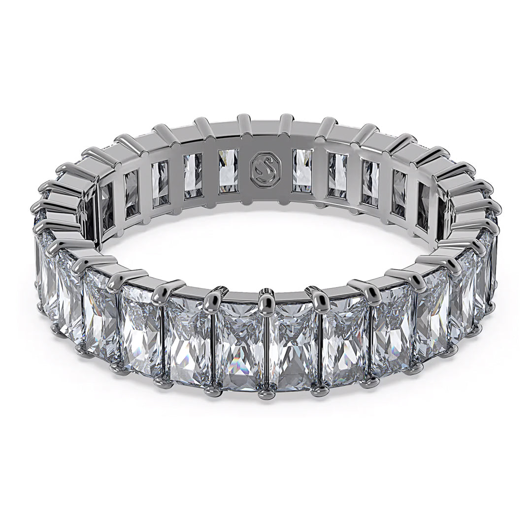The Swarovski Matrix Ring, crafted by Swarovski, features large rectangular baguette-cut stones set around its silver band to form a continuous and elegant pattern. Prongs secure the stones in place, enhancing their sparkle.