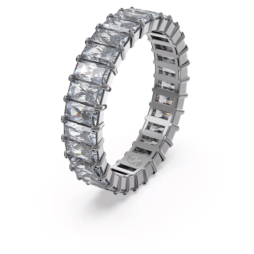 Introducing the Swarovski Matrix Ring from Swarovski, a stunning eternity band featuring baguette-cut stones arranged in an endless sequence. Its high-polish finish and glittering stones, enhanced with ruthenium plating, impart a luxurious and elegant look.
