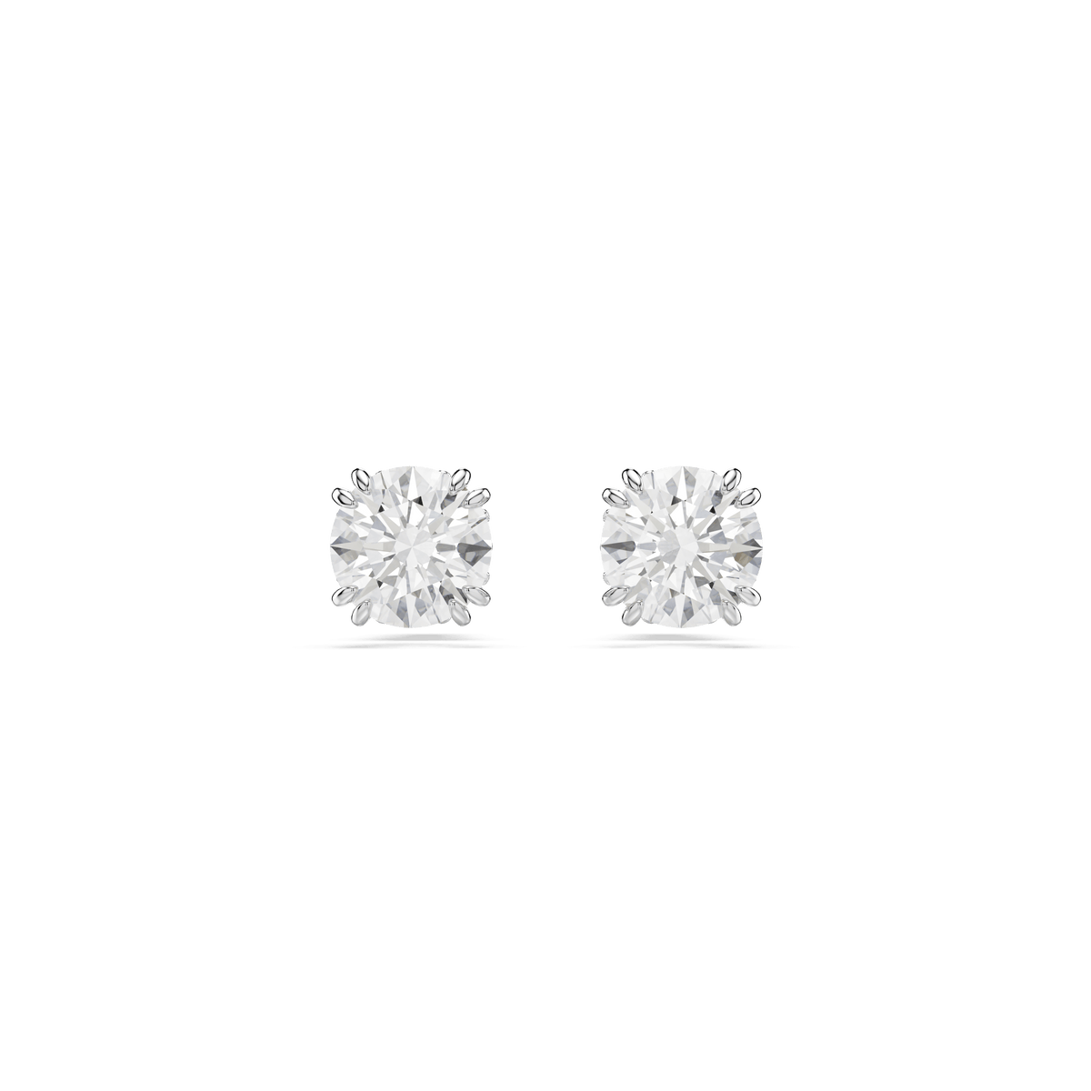A pair of Swarovski Stilla stud earrings featuring round-cut white crystals and a rhodium-plated finish, displayed side by side on a plain white background.